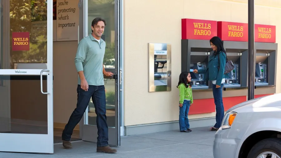 A man exits a bank branch. Whilst digital banking are often considered to be the future of the industry, data indicates that it is currently not enough to offset the loss of sales from branches (Photo from Wells Fargo)