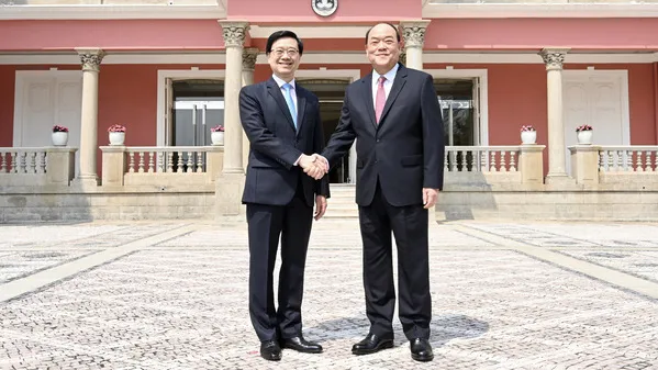 Chief Executive John Lee (left) meets Macau Chief Executive Ho Iat-seng at the Macau Special Administrative Region Government Headquarters. (Photo from news.gov.hk)