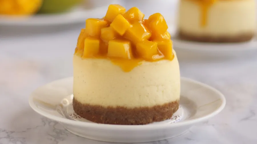 Vanilla cheesecake with mango toppings /Magnolia Bakery