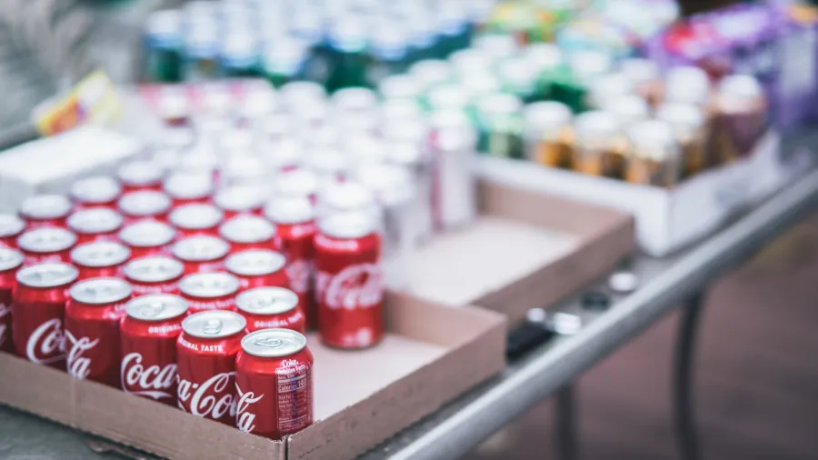 Photo by Craig Adderley: https://www.pexels.com/photo/selective-focus-photography-of-red-coca-cola-can-lot-on-box-1561147/