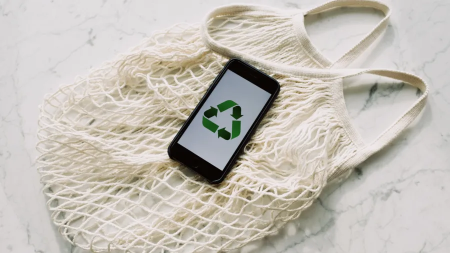 Photo by ready made: https://www.pexels.com/photo/mobile-phone-with-green-recycling-sign-and-mesh-bag-3850512/