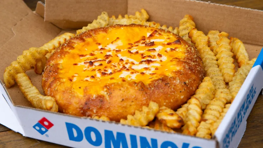 Press photo. /Domino's