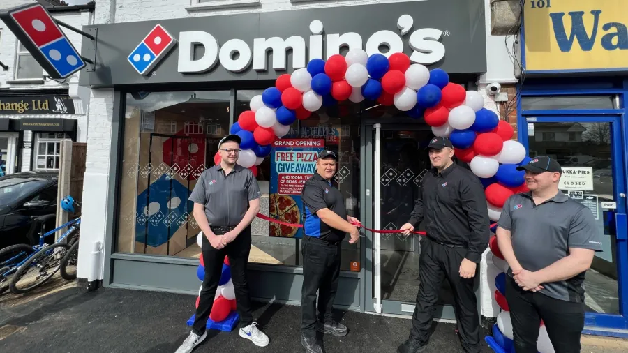 Press photo. /Domino's
