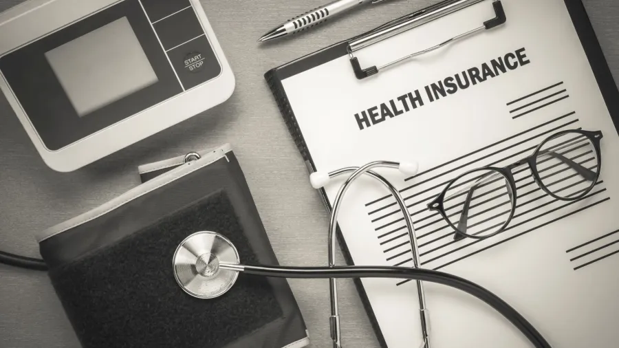 Health insurance form with eyeglasses