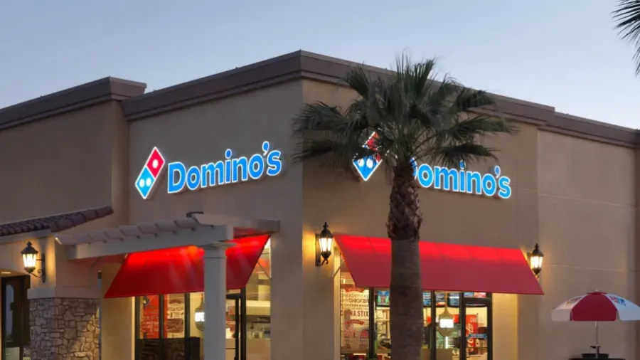 Press photo. / Domino's