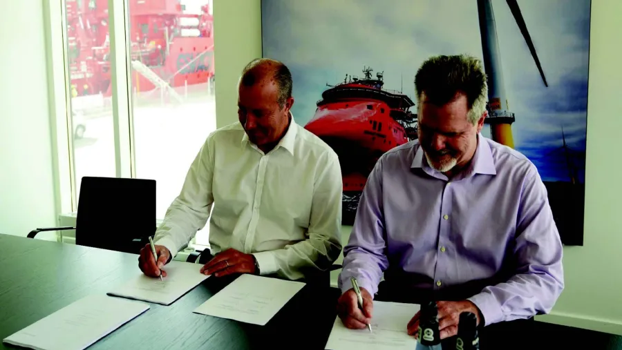 Pictured (left to right): Peter Lytzen, CEO, ESVAGT, and Jeff Andreini, VP, Crowley Wind Services, meet to execute additional joint venture agreements