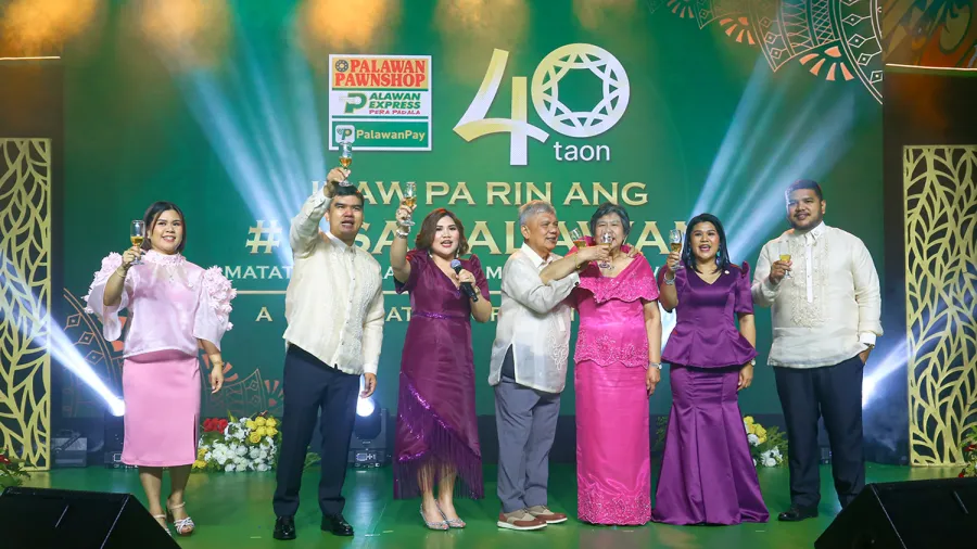 Palawan Group of Companies executives raise a toast to 40 years of shared success, trust, and service excellence.