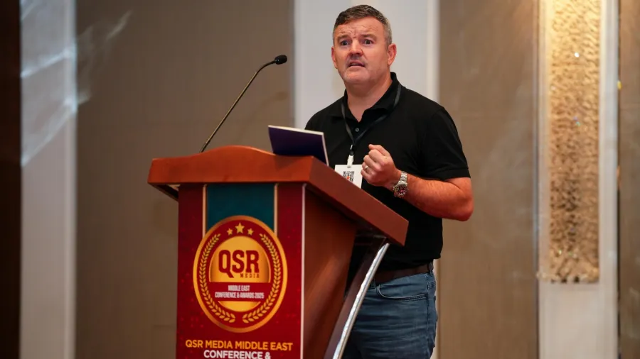 Alan Honan, vice-president and head of international development at Wingstop speaking at the QSR Media Middle East Conference & Awards 2025.