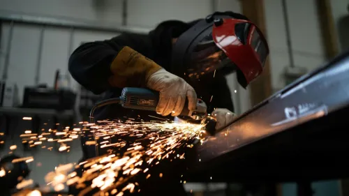 Manufacturing momentum eases in March but PMI still signals expansion
