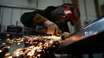 Manufacturing momentum eases in March but PMI still signals expansion